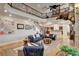 Spacious living room with high ceilings, a fireplace, and comfortable seating arrangement at 1182 Thomas Bay Cir, Logandale, NV 89021