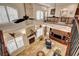 Overhead view of open living space with stone fireplace, high ceilings, railings, and travertine flooring at 1182 Thomas Bay Cir, Logandale, NV 89021