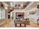 Open-concept living room with a high ceiling, fireplace, and plenty of natural light at 1182 Thomas Bay Cir, Logandale, NV 89021