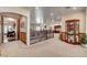 Inviting loft area with wooden accents, seamlessly connecting different living spaces and showcasing the home's open design at 1182 Thomas Bay Cir, Logandale, NV 89021