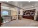 Bright and airy loft space with custom built-in bookshelves, and arched entryways, ideal for a home office or library at 1182 Thomas Bay Cir, Logandale, NV 89021
