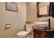 Cozy powder room featuring stylish fixtures and a unique vanity at 1182 Thomas Bay Cir, Logandale, NV 89021