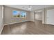 Bedroom showcasing luxury vinyl plank flooring, two windows, and neutral paint at 125 Sharp Edge Ave, North Las Vegas, NV 89031