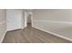Bedroom showing luxury vinyl plank flooring, closet doors, and neutral paint at 125 Sharp Edge Ave, North Las Vegas, NV 89031