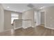 Upstairs hallway features wood-look floors and neutral color scheme at 125 Sharp Edge Ave, North Las Vegas, NV 89031
