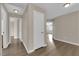 Bright hallway with wood-look floors and neutral colored walls at 125 Sharp Edge Ave, North Las Vegas, NV 89031