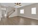 Inviting living room with hardwood flooring and a staircase at 125 Sharp Edge Ave, North Las Vegas, NV 89031