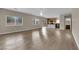 Open layout with hardwood floors, connecting the living room and kitchen at 125 Sharp Edge Ave, North Las Vegas, NV 89031