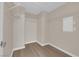Empty walk-in closet with white wire shelving and wood-look floors at 125 Sharp Edge Ave, North Las Vegas, NV 89031
