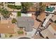 Aerial view showcasing the property layout, including the pool, patio, and surrounding landscape at 1520 Della Ct, Boulder City, NV 89005