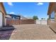 Expansive backyard with privacy wall, desert landscaping and double gate access at 1520 Della Ct, Boulder City, NV 89005