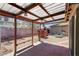 Charming backyard featuring a covered patio, a pizza oven, a fire pit, and desert landscaping at 1520 Della Ct, Boulder City, NV 89005