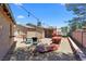 Cozy backyard featuring a brick oven, ample seating, and gravel landscaping, perfect for outdoor entertaining at 1520 Della Ct, Boulder City, NV 89005