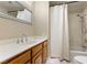 Bathroom featuring a full shower-tub combo, white countertops and wood cabinets at 1520 Della Ct, Boulder City, NV 89005