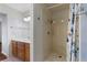 Clean bathroom featuring a stand-up shower with a shower curtain and wood cabinets at 1520 Della Ct, Boulder City, NV 89005
