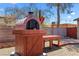 Outdoor brick oven with wood storage and prep space, ideal for pizza nights and outdoor cooking at 1520 Della Ct, Boulder City, NV 89005
