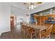 Open-concept dining area features wood floors and leads to the kitchen and living room at 1520 Della Ct, Boulder City, NV 89005