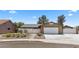 Charming single-story home with a well-maintained front yard and a two-car garage at 1520 Della Ct, Boulder City, NV 89005
