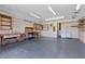 Spacious garage with ample storage, a workbench, and industrial lighting at 1520 Della Ct, Boulder City, NV 89005