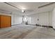 Spacious garage with a sink and door to access to backyard at 1520 Della Ct, Boulder City, NV 89005