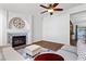 Stylish living room features a fireplace, wood floors, and comfortable seating arrangement at 1520 Della Ct, Boulder City, NV 89005