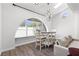 Cozy living room with vaulted ceilings, an arched window, and comfortable seating at 1520 Della Ct, Boulder City, NV 89005