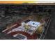 Aerial view of home showing perimeter fencing and city skyline in the distance at 1731 Sherwin Ln, Las Vegas, NV 89156