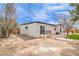 This backyard features two patio decks and a small grassy area, all enclosed by a secure perimeter fence at 1731 Sherwin Ln, Las Vegas, NV 89156