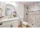 Modern bathroom features a tiled walk-in shower and marble vanity at 1731 Sherwin Ln, Las Vegas, NV 89156