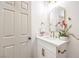 Updated bathroom features a modern vanity, framed mirror, and gold fixtures at 1731 Sherwin Ln, Las Vegas, NV 89156