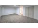 A spacious bedroom featuring neutral carpet, closet, and a connecting bathroom at 1731 Sherwin Ln, Las Vegas, NV 89156