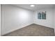 A bright carpeted bedroom featuring neutral paint and a single window at 1731 Sherwin Ln, Las Vegas, NV 89156