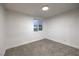 A bright carpeted bedroom featuring neutral paint and a single window at 1731 Sherwin Ln, Las Vegas, NV 89156