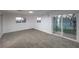 A spacious bedroom with a window and sliding glass door to the outside at 1731 Sherwin Ln, Las Vegas, NV 89156