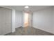 A carpeted bedroom featuring neutral paint, a closet, and an entry doorway at 1731 Sherwin Ln, Las Vegas, NV 89156