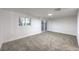 A spacious bedroom with a window and sliding glass door to the outside at 1731 Sherwin Ln, Las Vegas, NV 89156