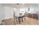 Bright dining area with a modern table set and seamless flow to the kitchen at 1731 Sherwin Ln, Las Vegas, NV 89156