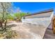 Exterior view of the house displaying the siding, window, landscaping, and fenced-in backyard at 1731 Sherwin Ln, Las Vegas, NV 89156