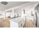 Bright open kitchen with a large island, white cabinets, and stainless steel appliances at 1731 Sherwin Ln, Las Vegas, NV 89156