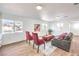 Sunlit living room boasts two plush chairs, a gray sofa, and charming decor at 1731 Sherwin Ln, Las Vegas, NV 89156