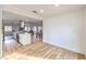 Open floor plan view of the kitchen, dining area, and living room featuring continuous wood flooring at 1731 Sherwin Ln, Las Vegas, NV 89156