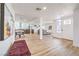 Open-concept living space with dining area, modern front door, and seamless flow at 1731 Sherwin Ln, Las Vegas, NV 89156
