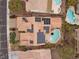 Aerial view of house with solar panels and backyard oasis pool, with gorgeous tile roof at 2151 Bannerwood St, Henderson, NV 89044