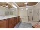 Bright bathroom features dual sinks, a soaking tub, and a glass-enclosed shower for modern living at 2151 Bannerwood St, Henderson, NV 89044