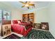 Cozy bedroom features a twin bed, natural light, and decor creating a warm and inviting space at 2151 Bannerwood St, Henderson, NV 89044