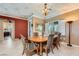 Cozy dining room featuring an elegant chandelier, marble tiled floor, and custom ceiling mural at 2151 Bannerwood St, Henderson, NV 89044