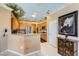 Bright kitchen with stainless steel appliances, breakfast bar, and unique ceiling mural at 2151 Bannerwood St, Henderson, NV 89044
