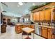 Open kitchen featuring granite counters, stainless appliances, and a view to the living area at 2151 Bannerwood St, Henderson, NV 89044