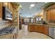 Gourmet kitchen with stainless steel appliances, granite counters, and a custom painted ceiling at 2151 Bannerwood St, Henderson, NV 89044