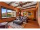 This living room offers hardwood floors, a wet bar, and a view of the pool area at 2151 Bannerwood St, Henderson, NV 89044